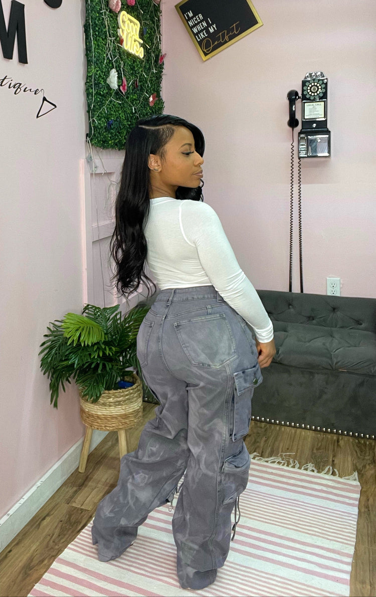 woman wearing cargo pants and white top