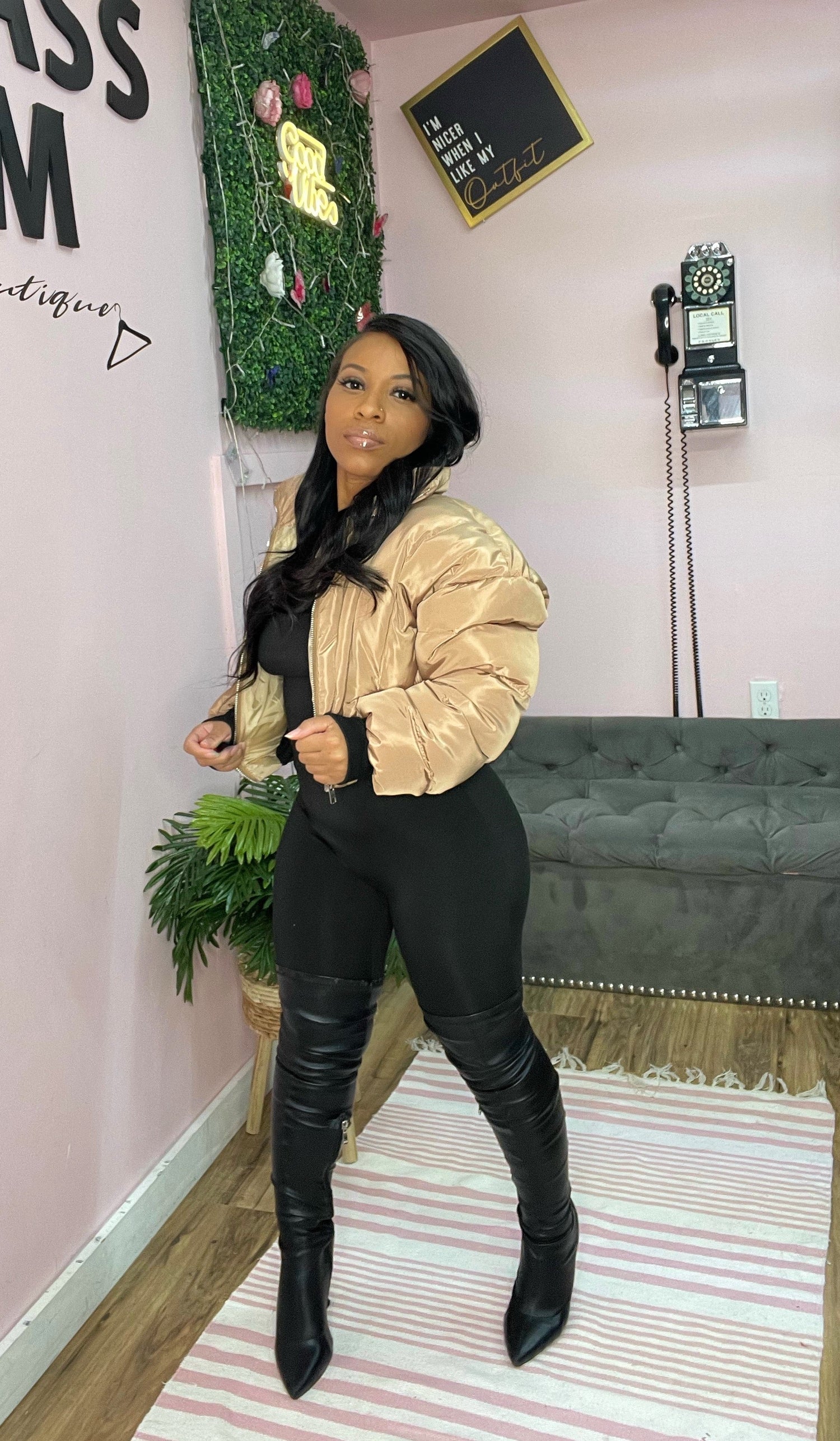 woman posing wearing tan crop bomber jacket